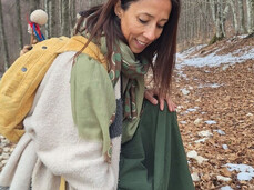 Annachiara Zecchetto gathering natural elements in the woods during a Nature Therapy session for the LiberaMente event taking place in Andalo, Paganella, Trentino.