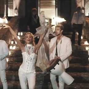  The image shows the group “Miguel Team Group,” consisting of four boys and one girl. They are all dressed in white.