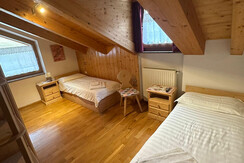 Attic room with single beds and windows