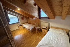 Attic room with beds and windows