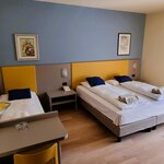  Foto von Dreibettzimmer